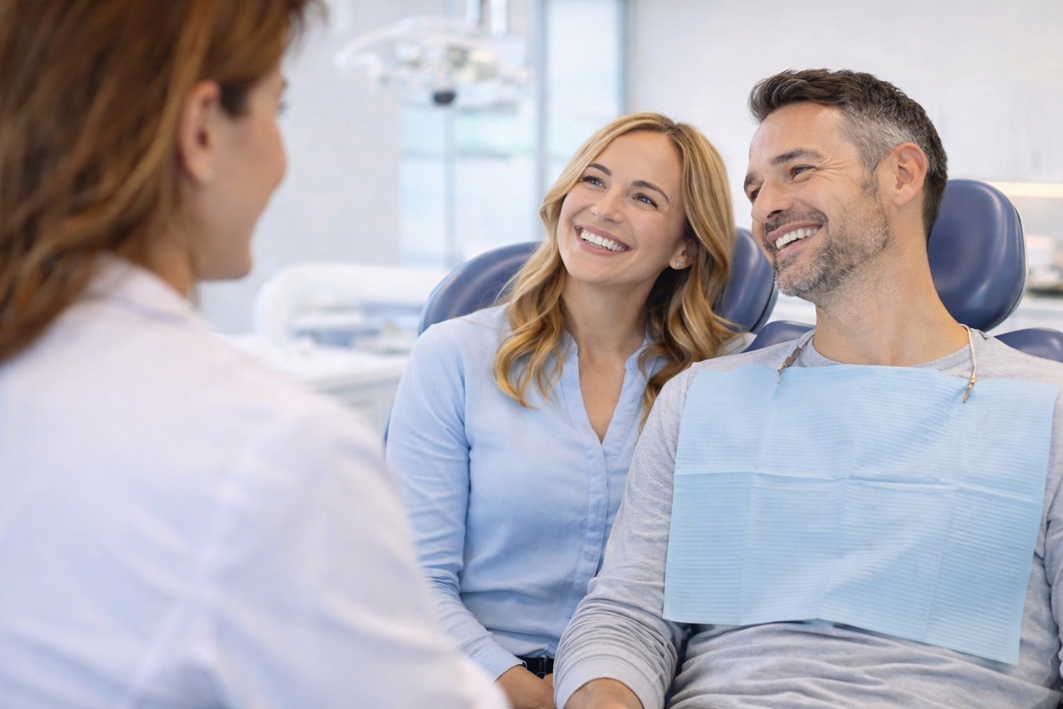 Happy couple at dental practice